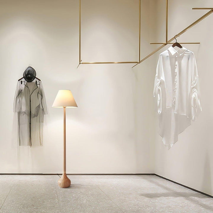 Osaka floor lamp in a stylish room with elegant attire, perfect for living room lighting in a rustic design.