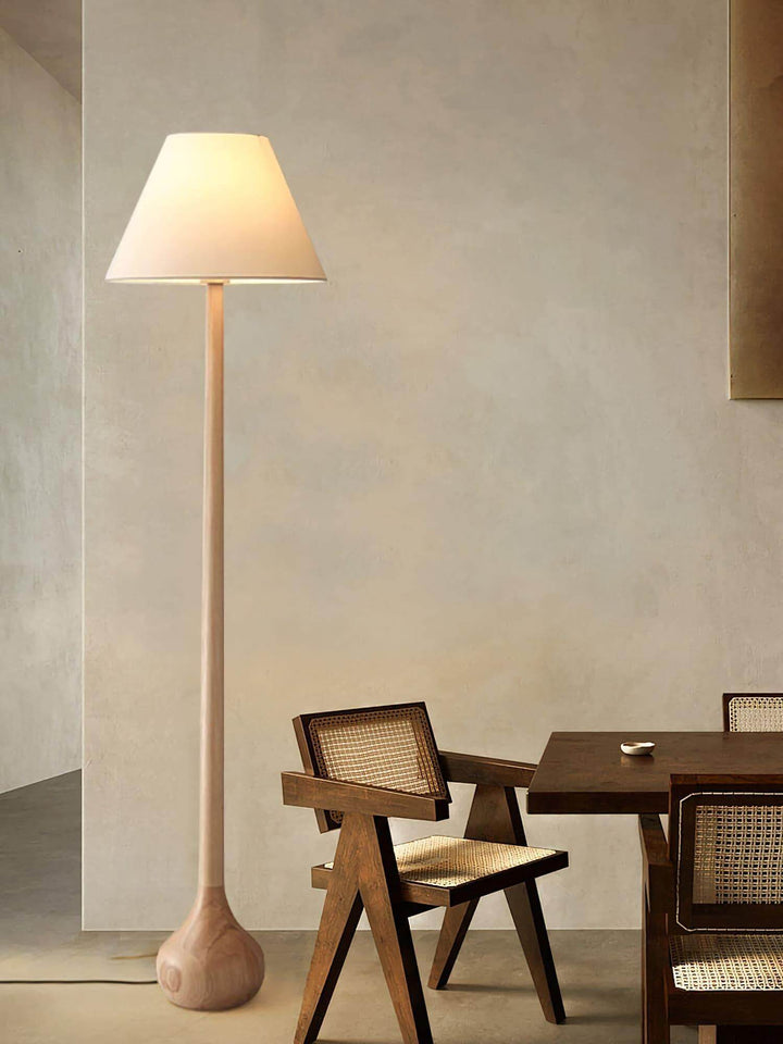 Osaka floor lamp in a minimalist setting, a wooden floor lamp adding rustic charm to living room decor.