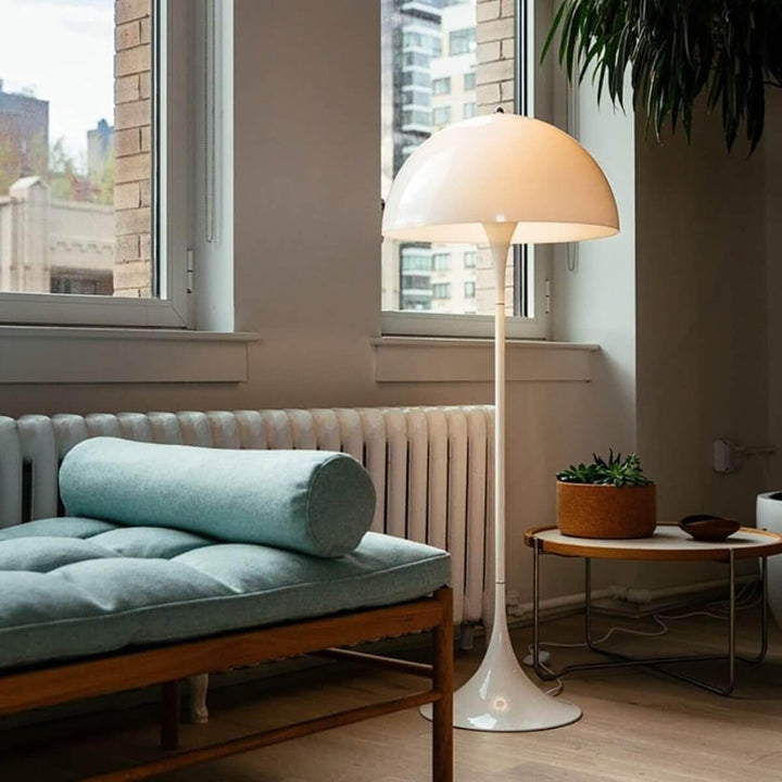Panthella floor lamp in a modern living room, sleek white acrylic design, ideal for stylish home decor.