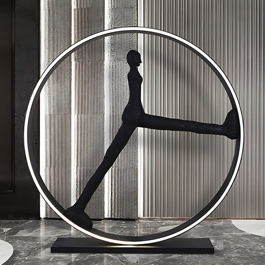 Sculptural art deco floor lamp with a unique figure design, perfect for stylish living room lighting.