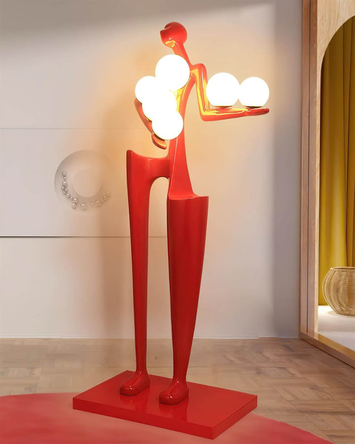 Quoreva sculptural floor lamp displayed in a stylish living room, featuring an art deco design with glowing spheres.