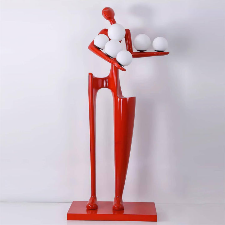 Quoreva sculptural floor lamp in vibrant red, showcasing a modern art deco design, perfect for living room lighting.