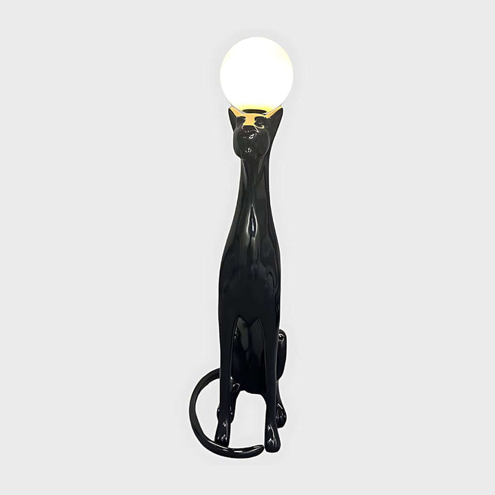 Sculptural black cat floor lamp with a round light fitting, perfect for adding unique style to any living space.