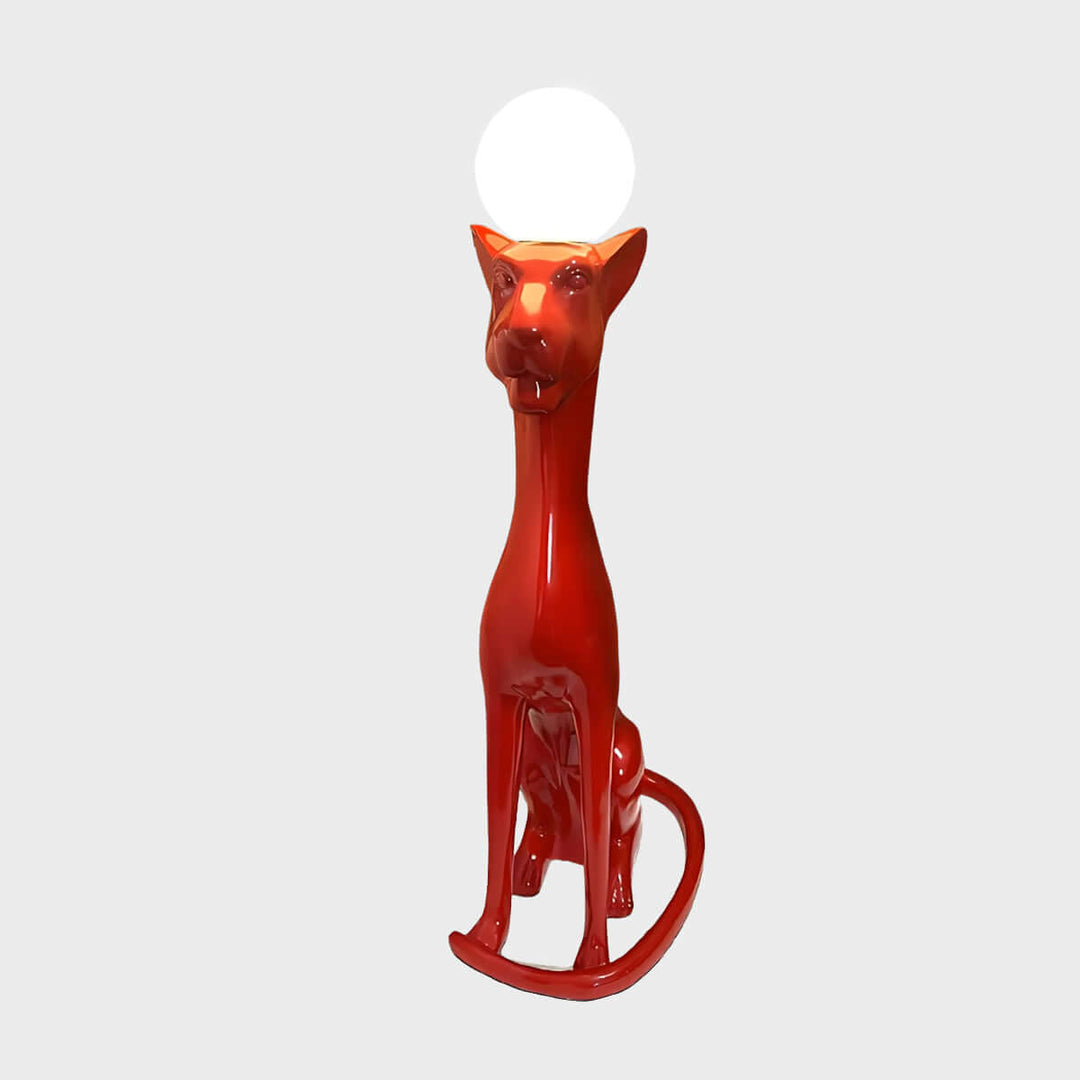 Red sculptural dog-shaped lamp with a round light, adding a playful touch to modern home decor.