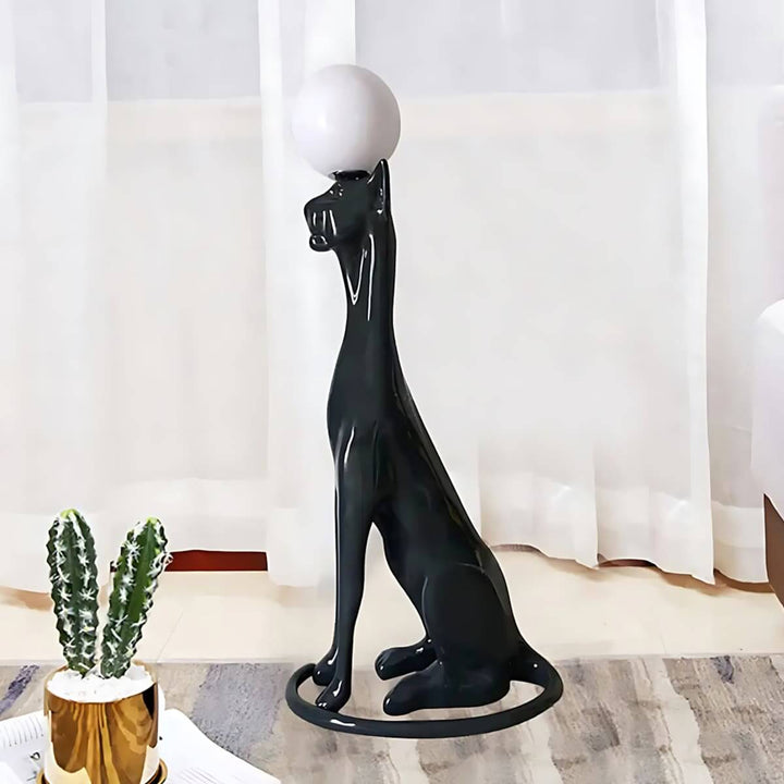 Black cat-shaped floor lamp with a round white light, adding a playful touch to modern home decor.