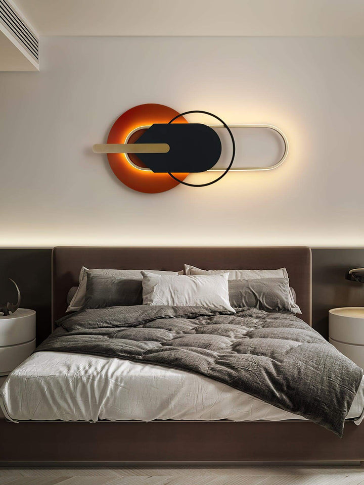 Contemporary round and oval wall light above a modern bed in a stylish bedroom, perfect for living rooms and large spaces.