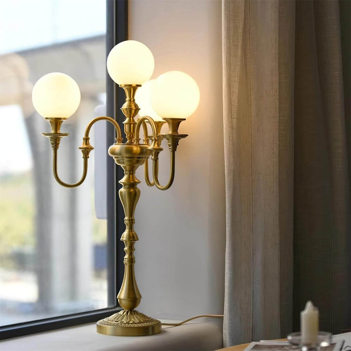 Elegant Solora brass table light with three globes, perfect mid-century modern table lamps for your living room.