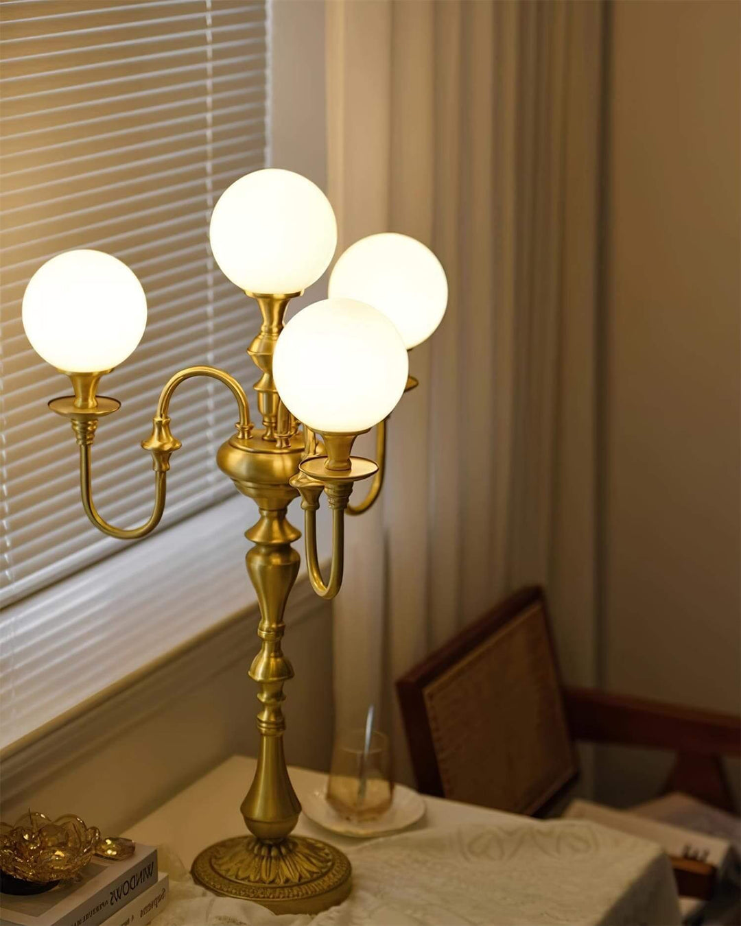 Solora brass table light with four globe shades, perfect for mid century modern decor in living room spaces.
