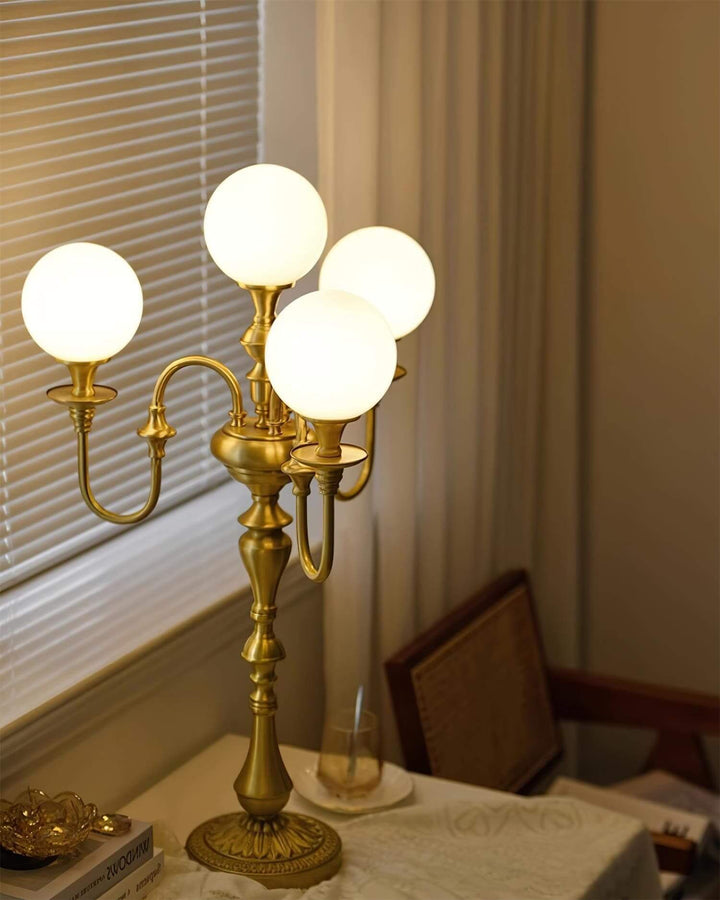 Solora brass table light with four globe shades, perfect for mid century modern decor in living room spaces.