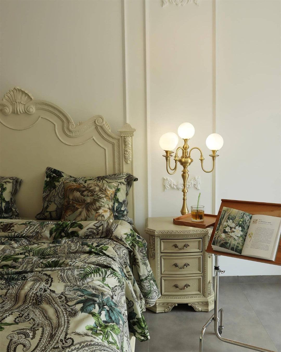 Solora brass table light beside an elegant bed, enhancing a mid-century modern living room aesthetic.