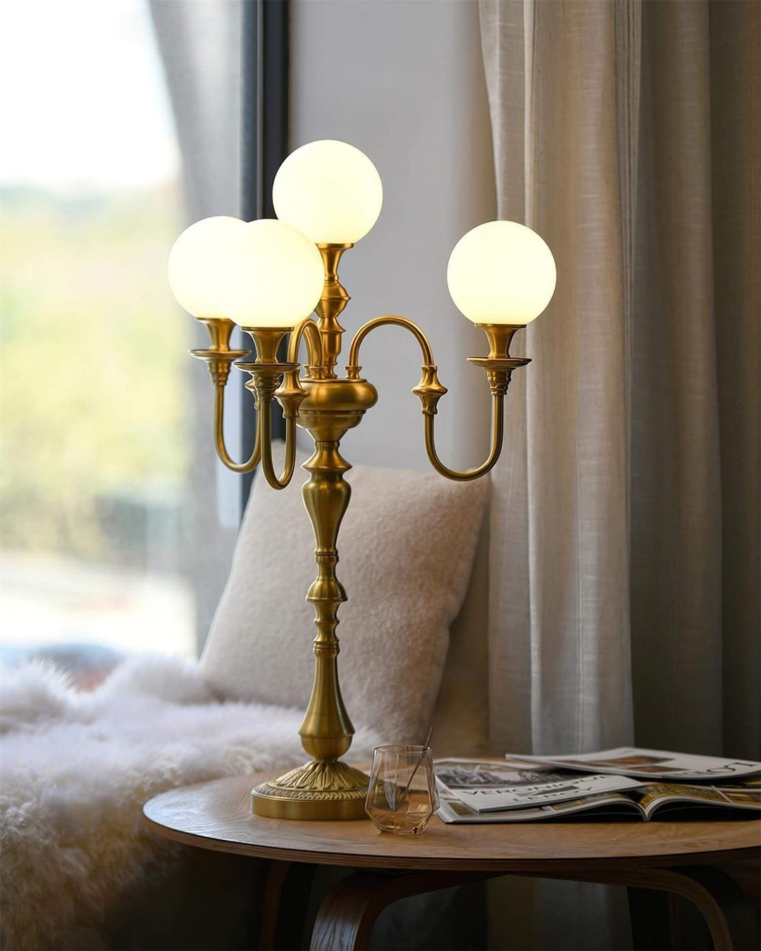 Elegant Solora brass table light featuring three globes, perfect for mid century modern decor in living rooms.