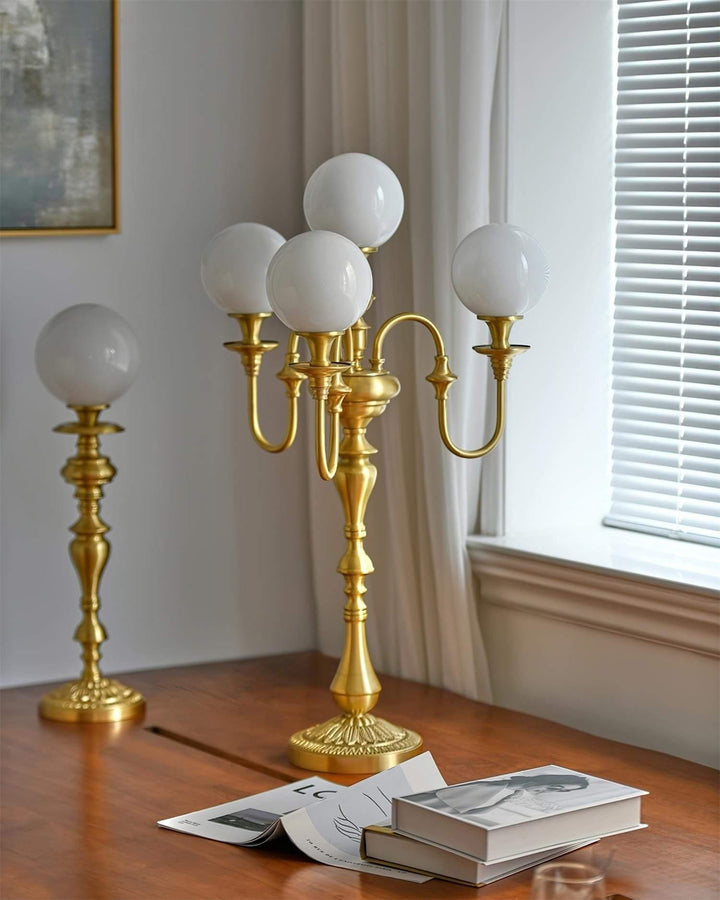 Elegant Solora brass table light with five globes, perfect for mid-century modern living room decor.