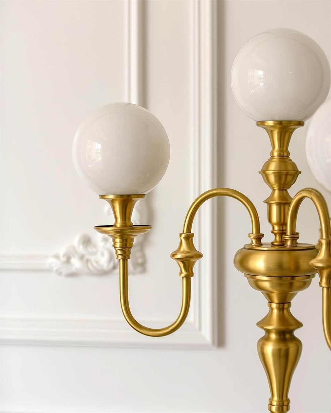 Solora brass table light with two spherical white shades, perfect for mid-century modern living room decor.