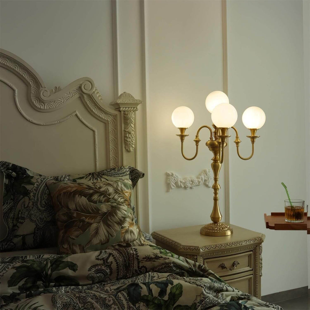 Elegant brass table light with glowing globes, perfect for mid-century modern living room decor, enhancing bedside ambiance.