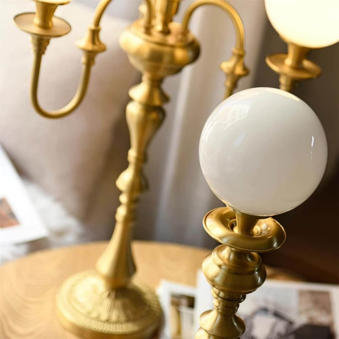 Elegant Solora brass table light featuring a chic mid-century modern design, perfect for living room ambiance.