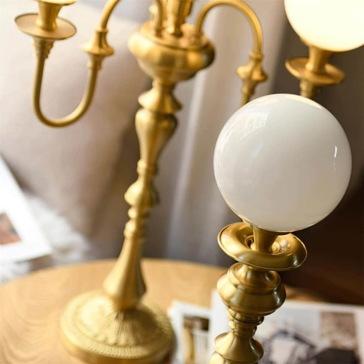 Elegant Solora brass table light featuring a chic mid-century modern design, perfect for living room ambiance.