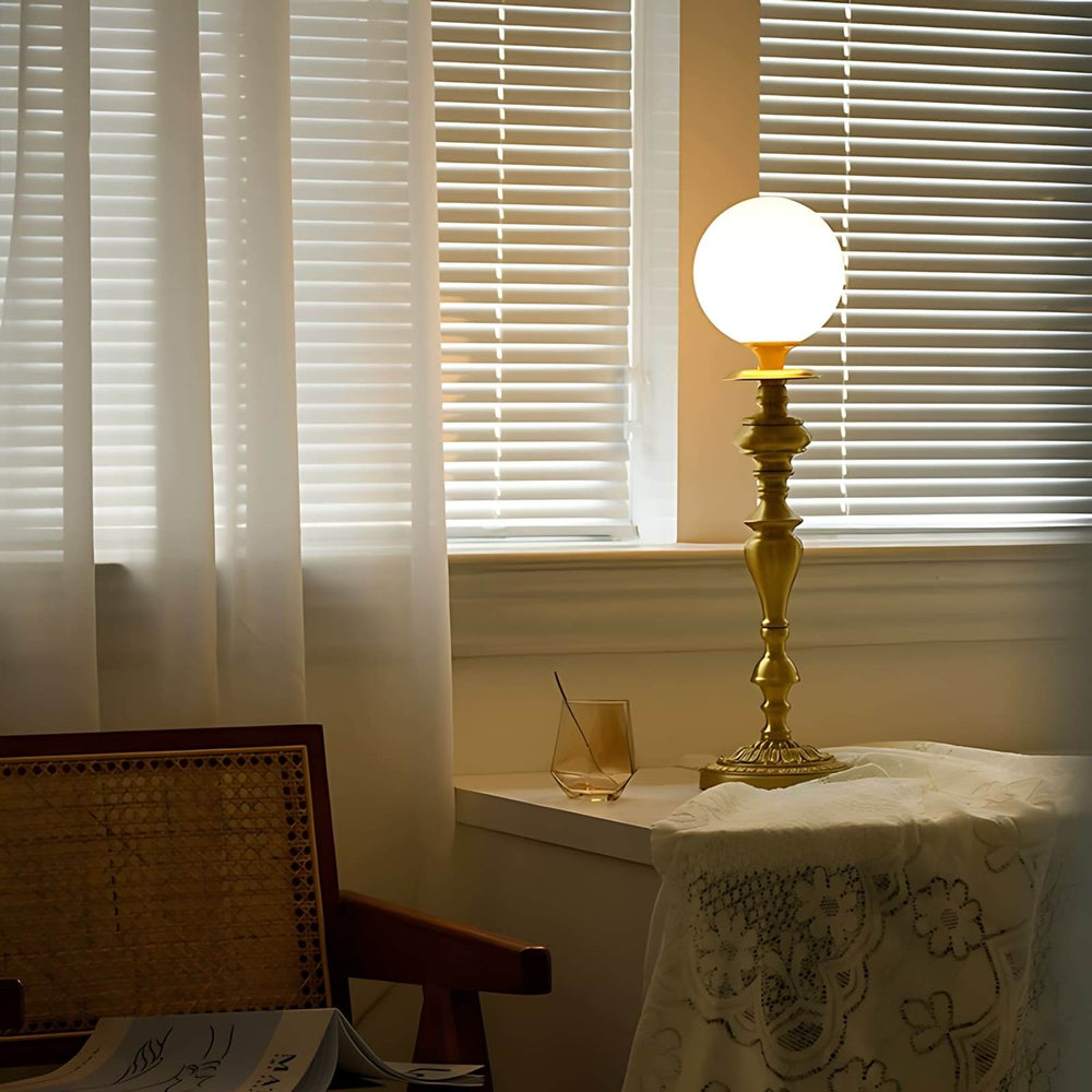Solora Table Light featuring a brass lamp with vintage milk glass globe, perfect table light for living room decor.