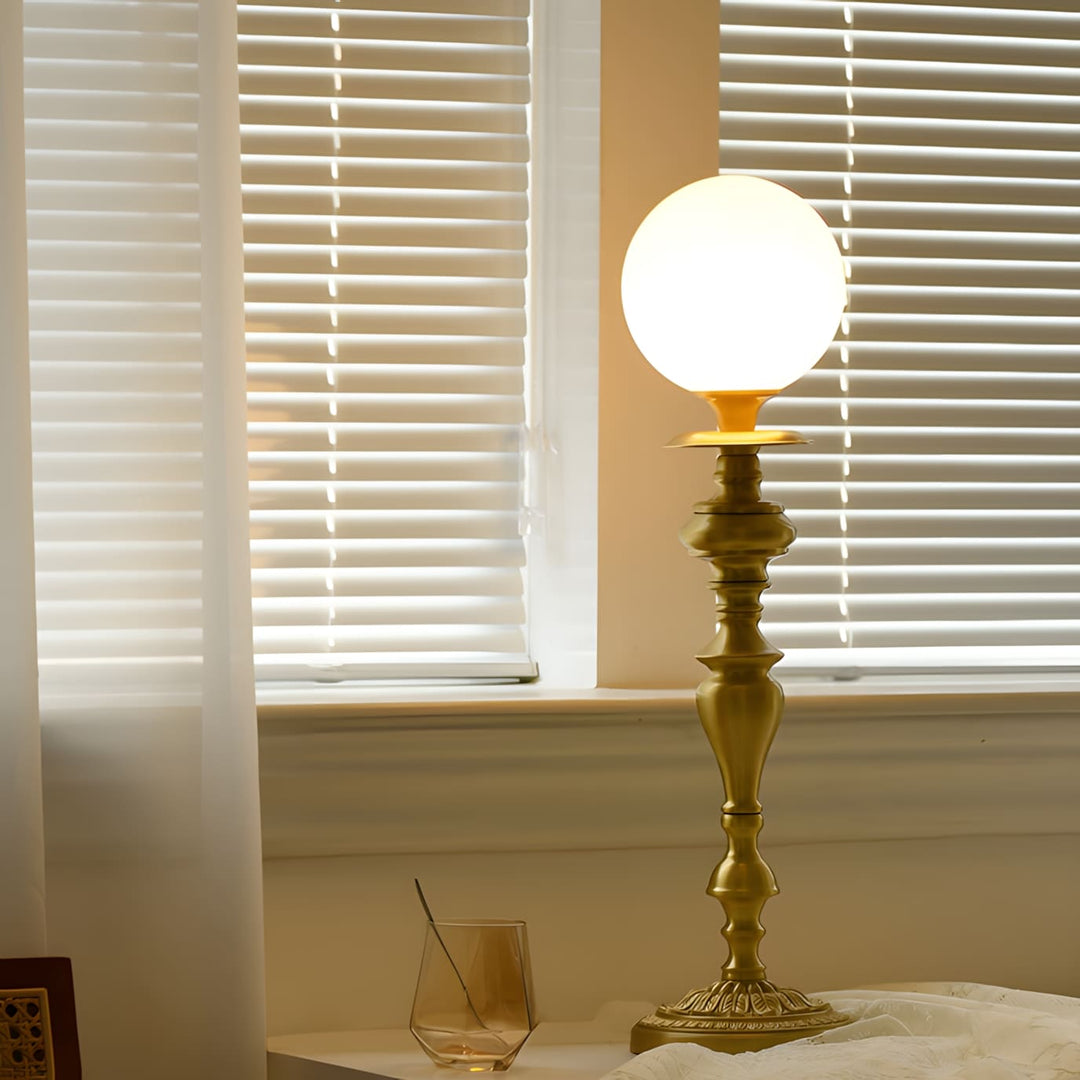 Solora Table Light, a brass lamp with vintage milk glass globe, perfect for table lights in living room decor.
