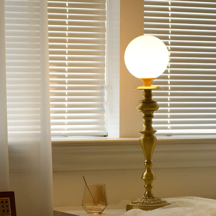 Solora Table Light, a brass lamp with vintage milk glass globe, perfect for table lights in living room decor.