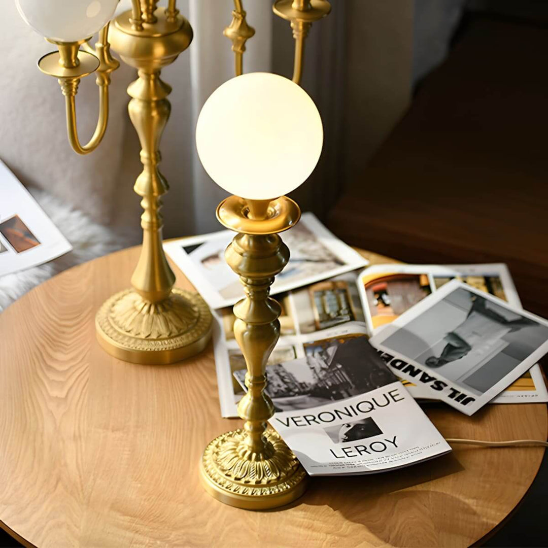 Stylish Solora table light with brass finish and vintage milk glass globe, perfect for living room lighting.