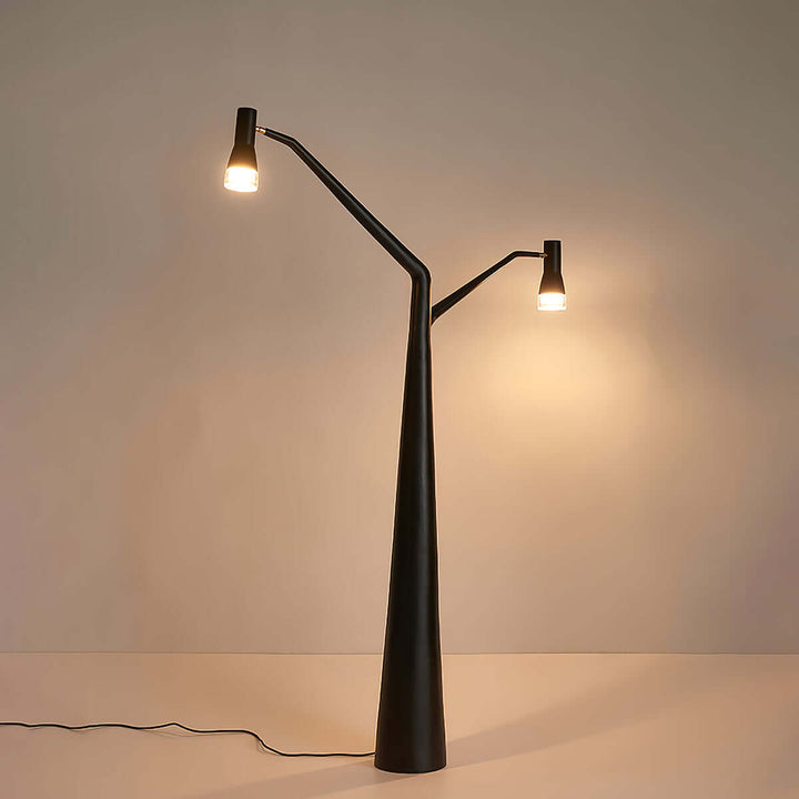 Soma Y-Floor Lamp, a sculptural floor lamp perfect for living rooms, featuring a unique design with dual light fixtures.