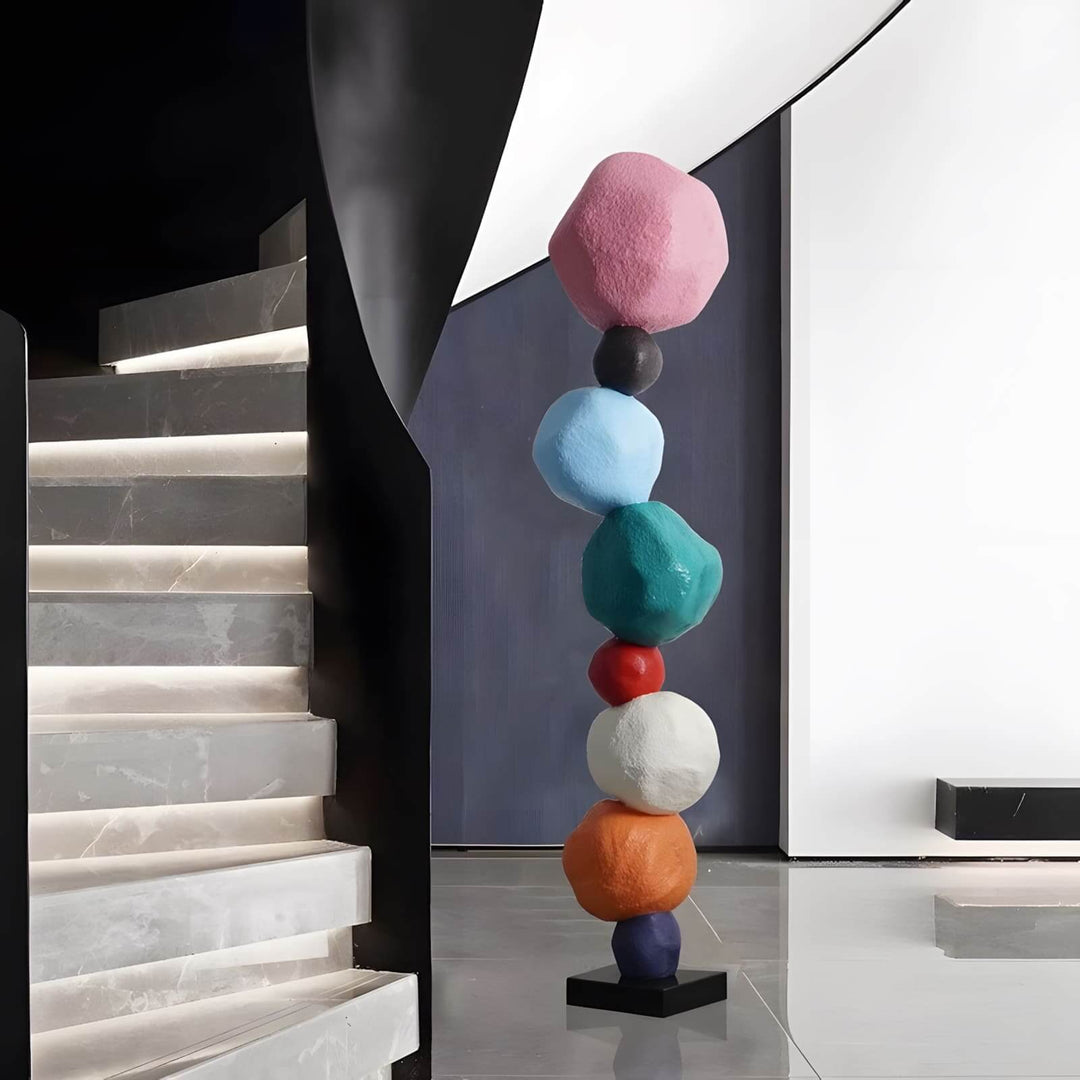 Colorful stacked stone resin sculpture as modern decorative ornament in stylish living room decor.