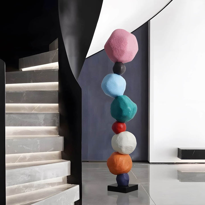 Colorful stacked stone resin sculpture as modern decorative ornament in stylish living room decor.