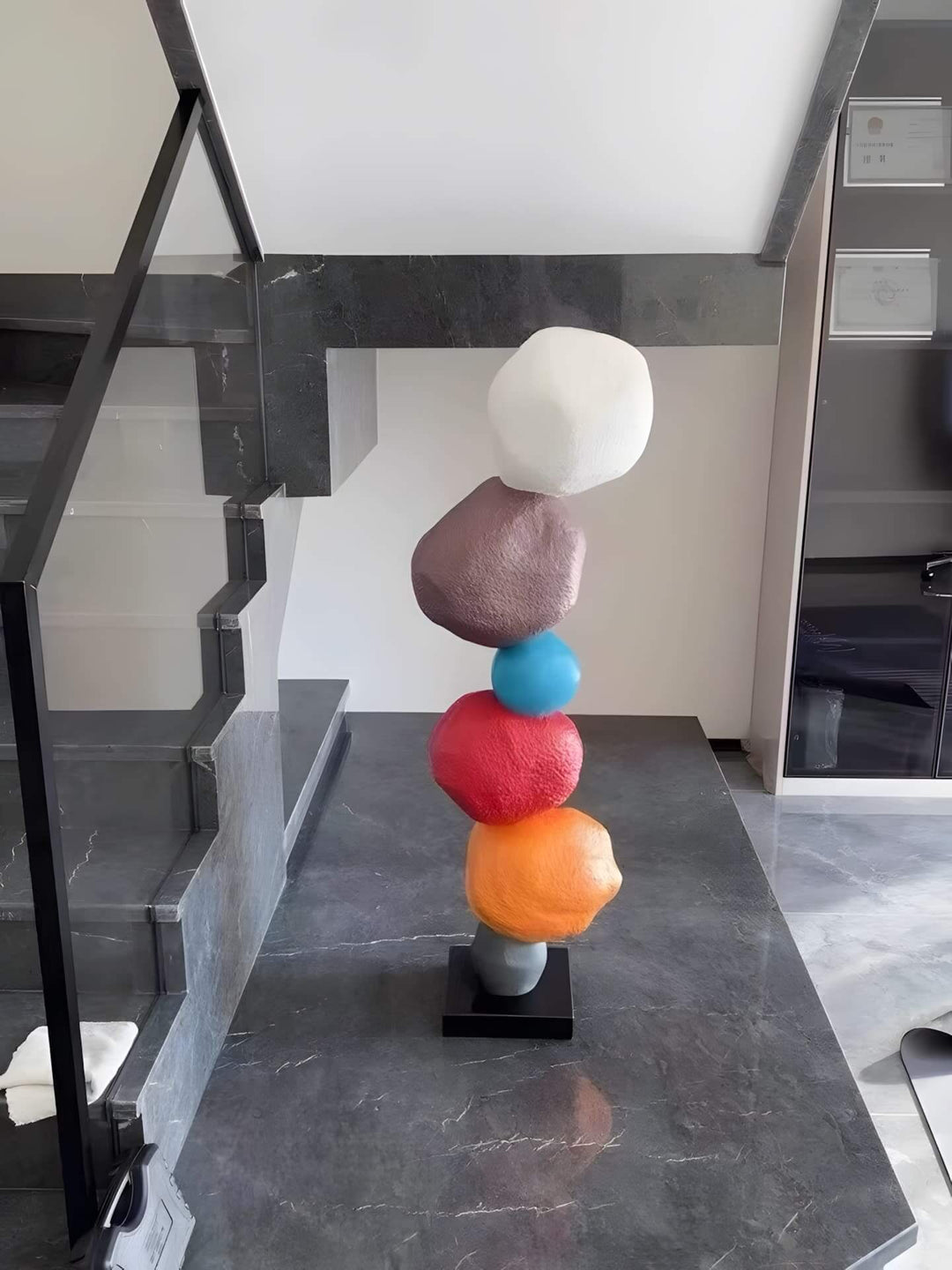 Colorful stacked stone sculpture, a modern Art Deco decorative ornament for living room decor.