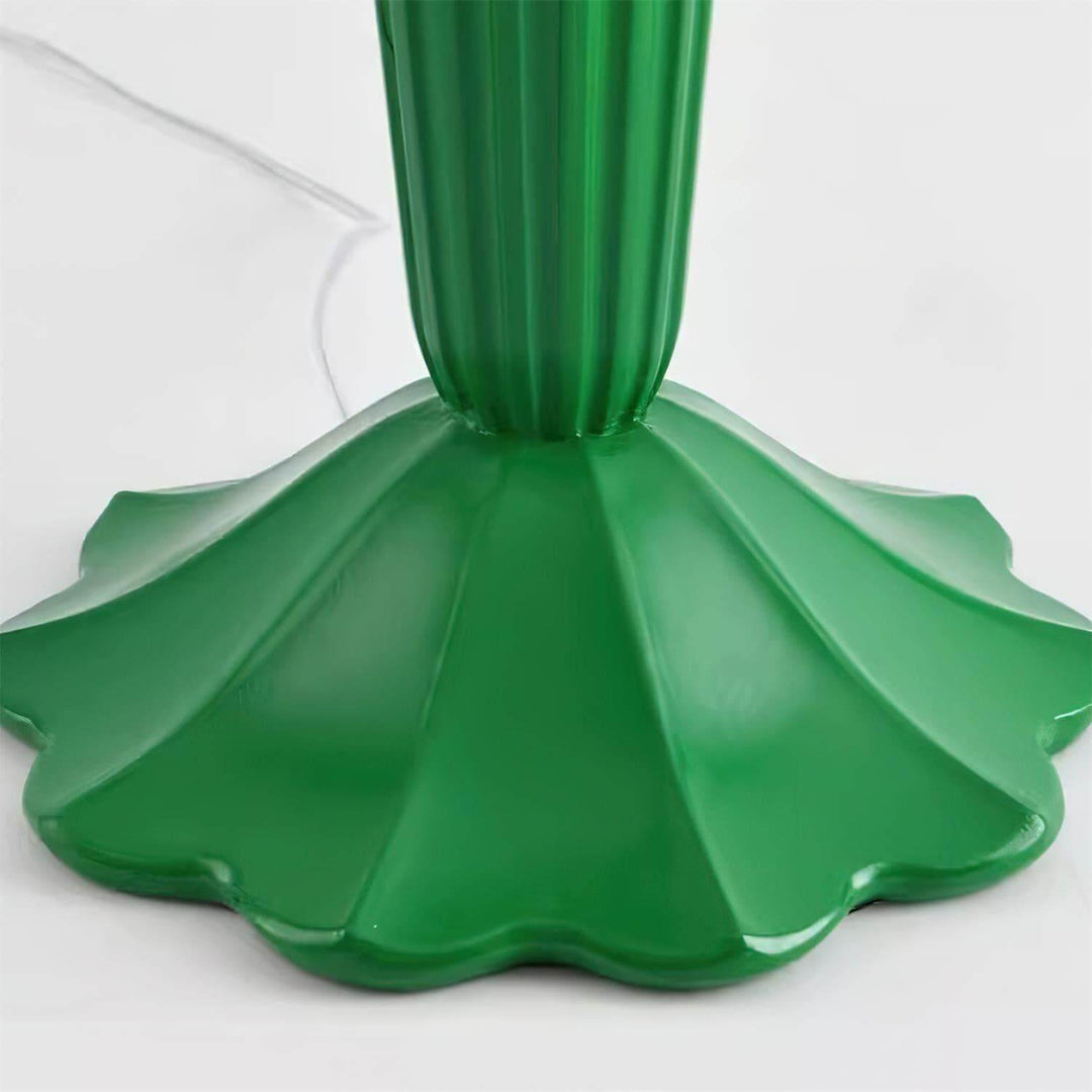 Close-up of the green base of a cactus floor lamp, showcasing its sculptural design and art deco style.