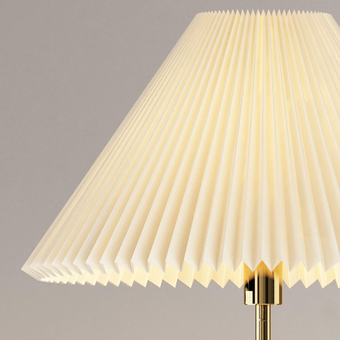 Close-up of the pleated lampshade of the Suki Pleated Floor Lamp, featuring a modern design and soft lighting.