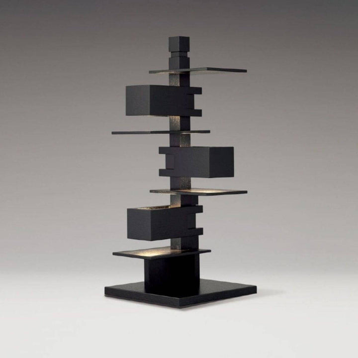 Art deco style table lamp designed with stacked geometric wood shapes, ideal for modern living room decor.