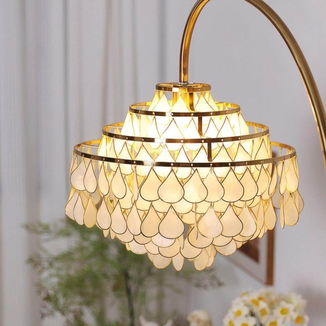 Coastal floor lamp with elegant teardrop shell design, perfect decorative lighting for bedroom and living spaces.