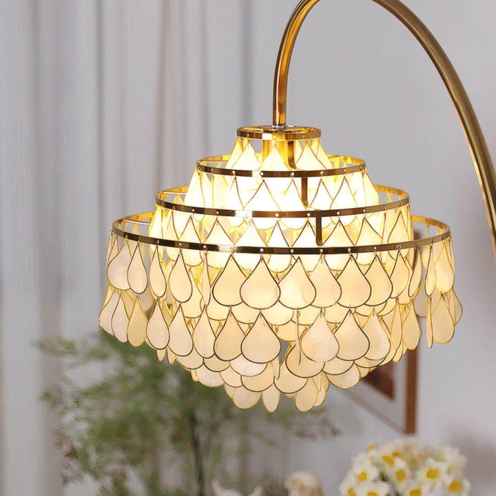 Coastal floor lamp with elegant teardrop shell design, perfect decorative lighting for bedroom and living spaces.