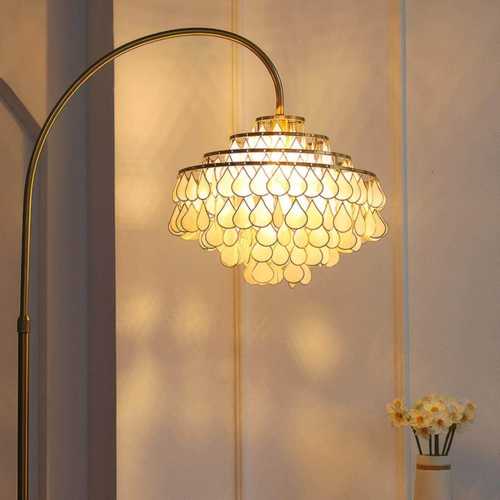 Coastal floor lamp with teardrop shell design, perfect decorative lighting for bedrooms and living spaces.
