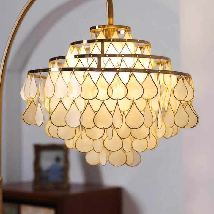 Coastal floor lamp featuring teardrop shell design, perfect decorative floor light for bedroom spaces.