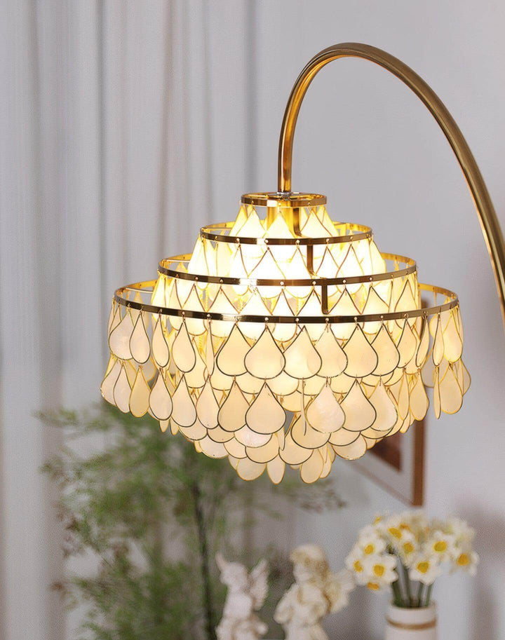 Coastal floor lamp with teardrop shell design, perfect for bedroom decor and ambient lighting.