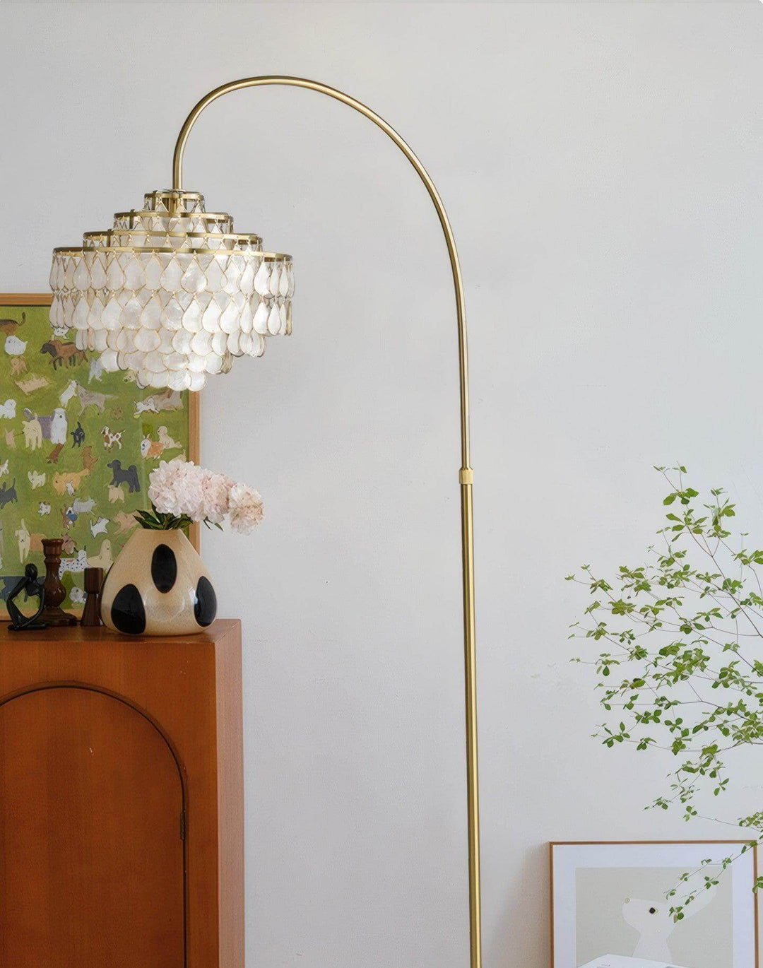 Coastal floor lamp with teardrop shell design, perfect decorative lighting for bedroom and living spaces.