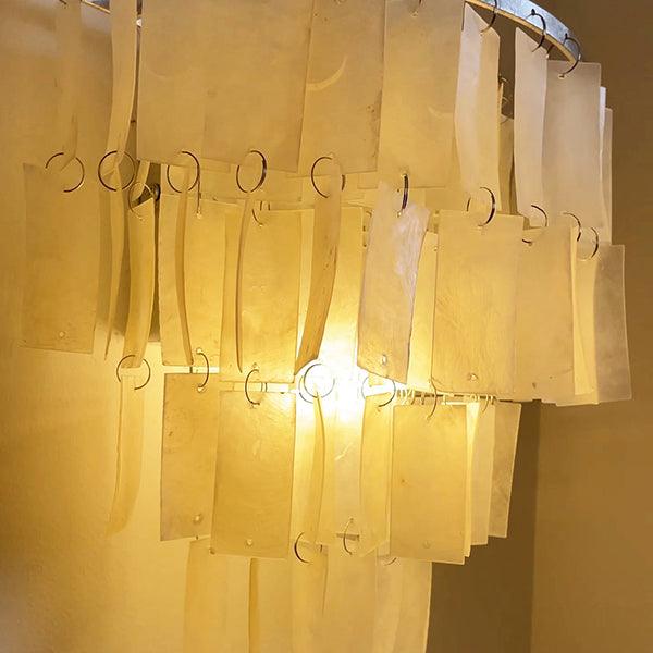 Elegant tiered wall lamp featuring a shell design, perfect as a coastal bedside wall light, 25cm diameter, 25cm height.