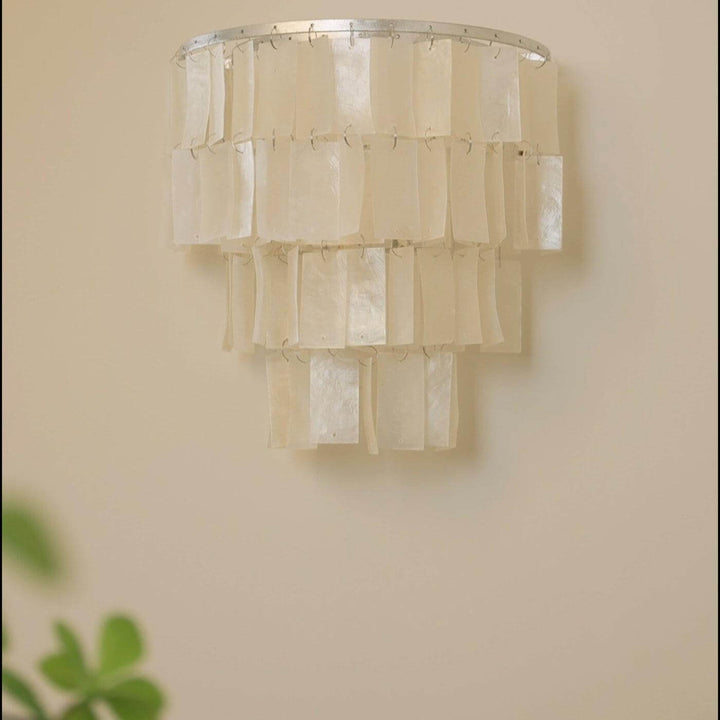 Elegant tiered wall lamp featuring a shell design, perfect as a coastal wall sconce or bedside wall light.