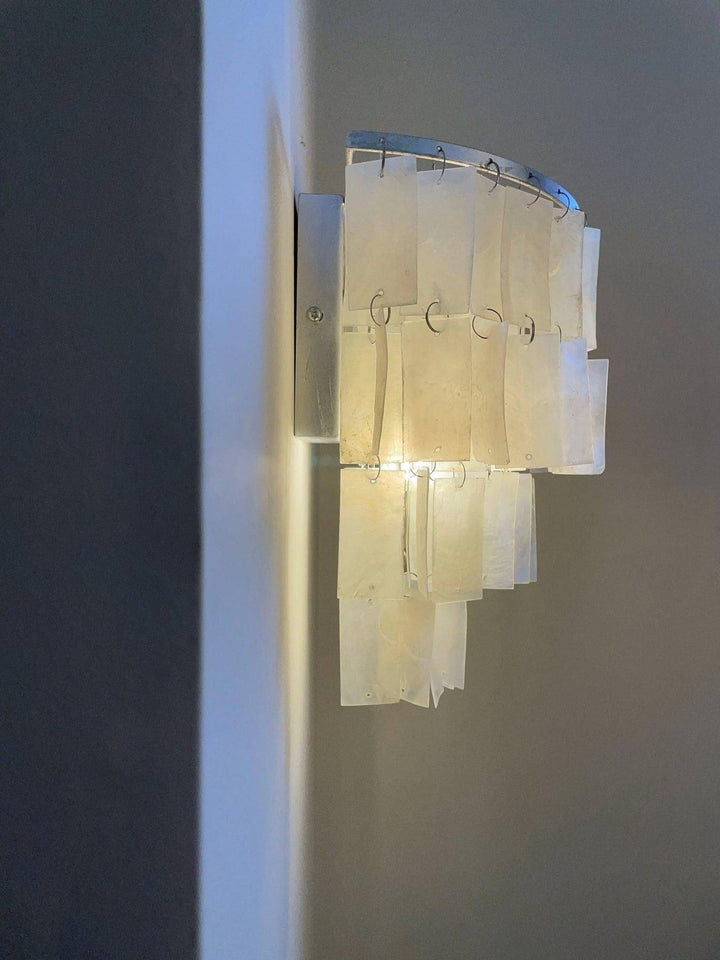 Elegant tiered wall lamp with shell design, perfect as a coastal wall sconce or bedside wall light.