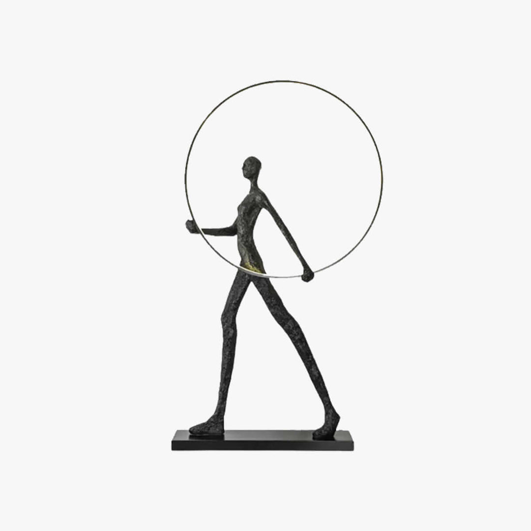 Sculptural floor lamp featuring an art deco style figure holding a ring, perfect for modern living room decor.