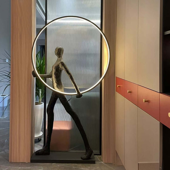 Tivoro Ring Floor Lamp in art deco style, showcasing sculptural design and ambient lighting for modern living space.