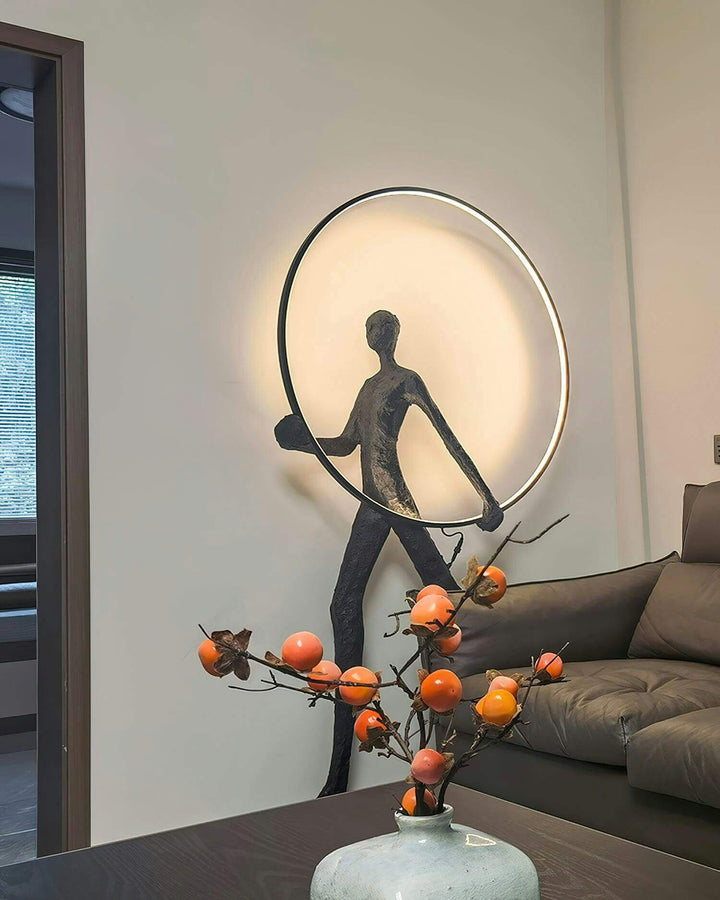 Tivoro sculptural floor lamp illuminating a modern living room with an artistic design and vibrant decor.