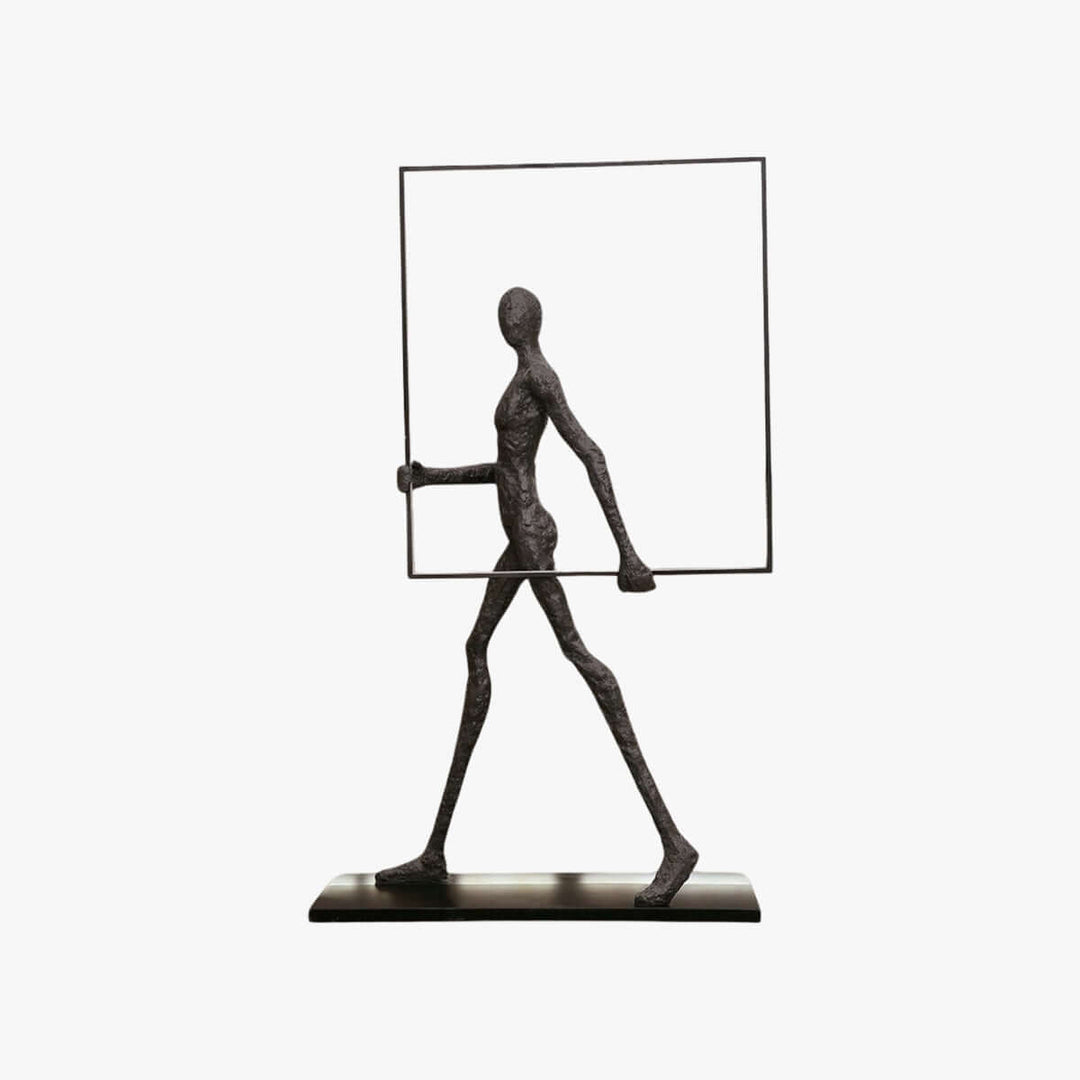 Sculptural figure holding a rectangular frame, showcasing an artistic design for modern decor.