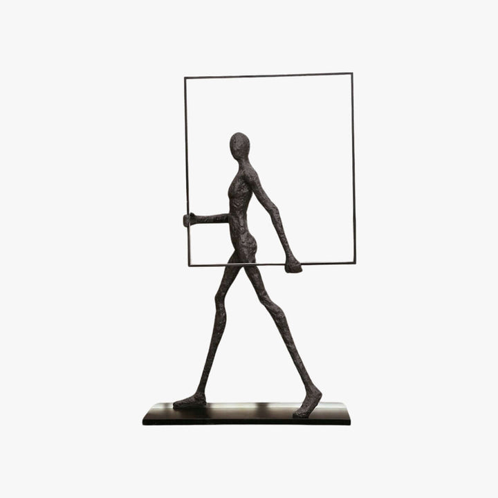 Sculptural figure holding a rectangular frame, showcasing an artistic design for modern decor.
