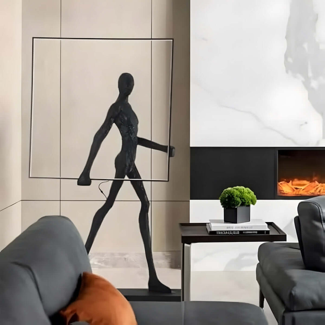 Sculptural floor lamp in modern living room, featuring a black figure design against a stylish backdrop.