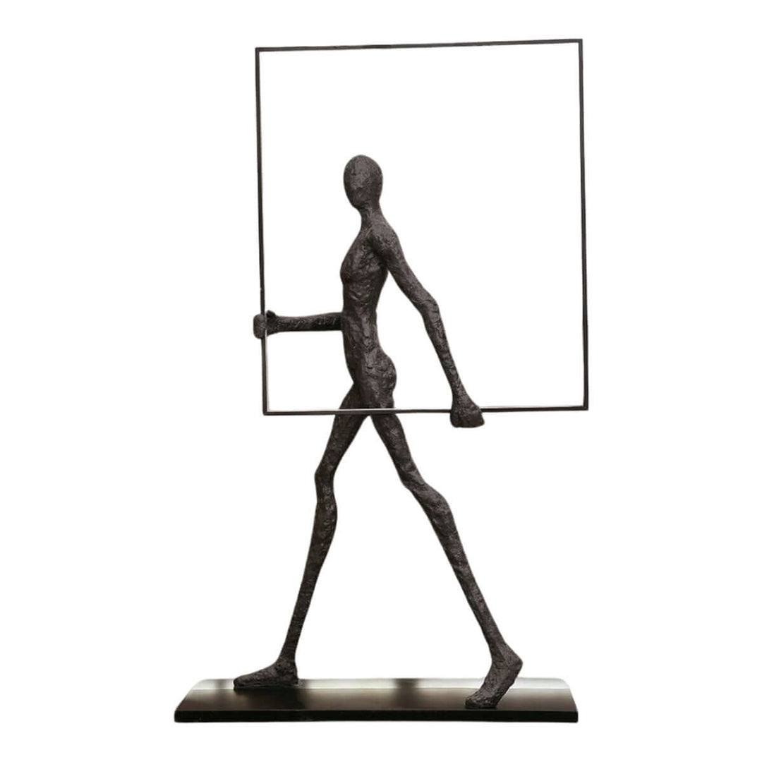 Sculptural figure holding a frame, modern art piece for contemporary decor.