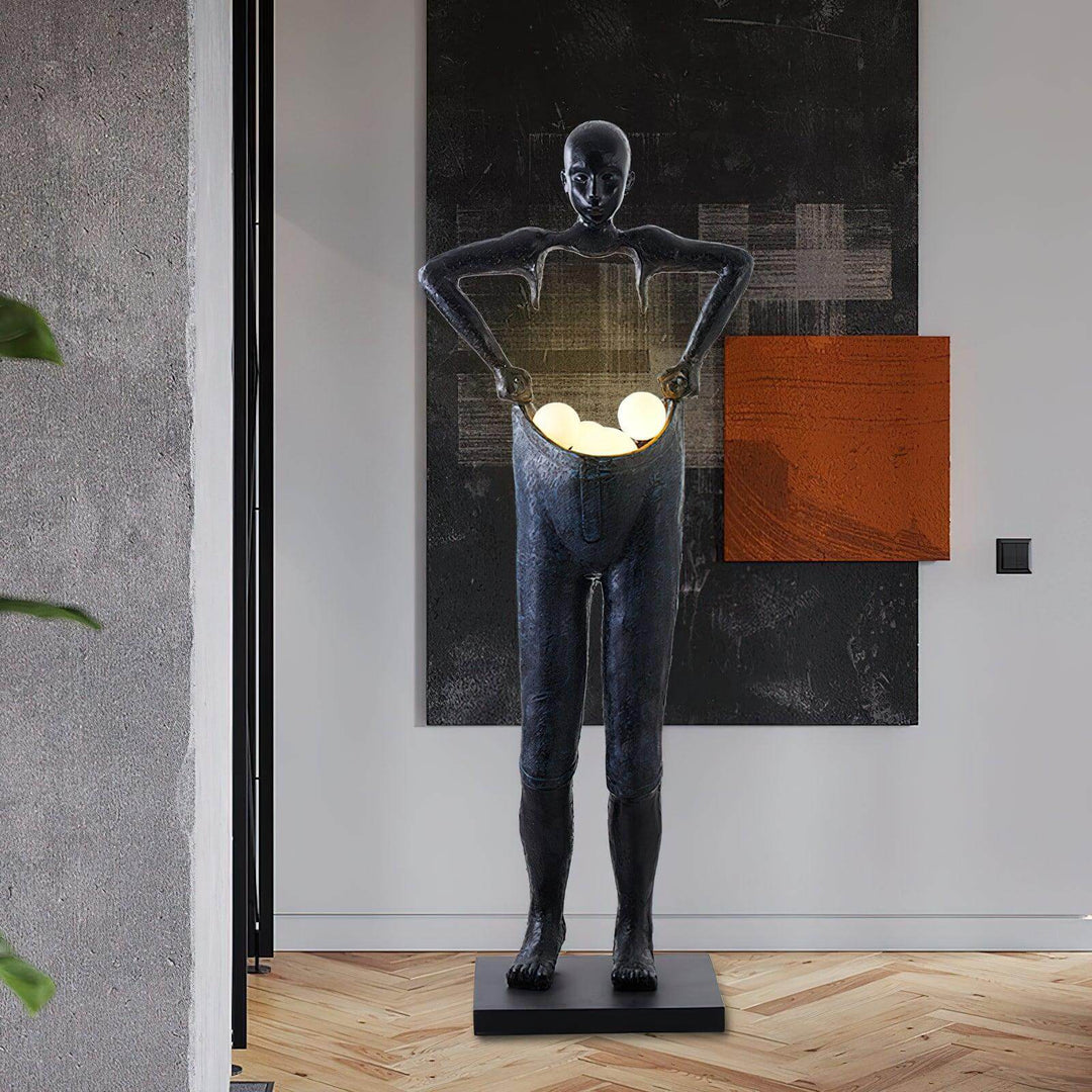 Sculptural art deco floor lamp in living room, resembling a human figure with glowing orbs, perfect floor lights for modern decor.