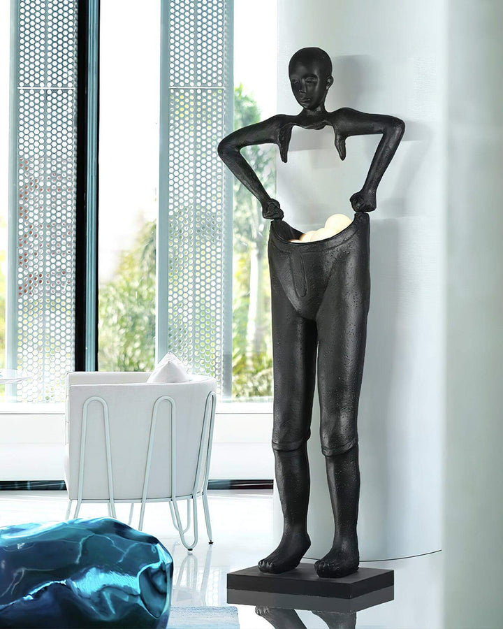 Art deco sculptural floor lamp resembling a figure, ideal as stylish floor lights for living room decor.