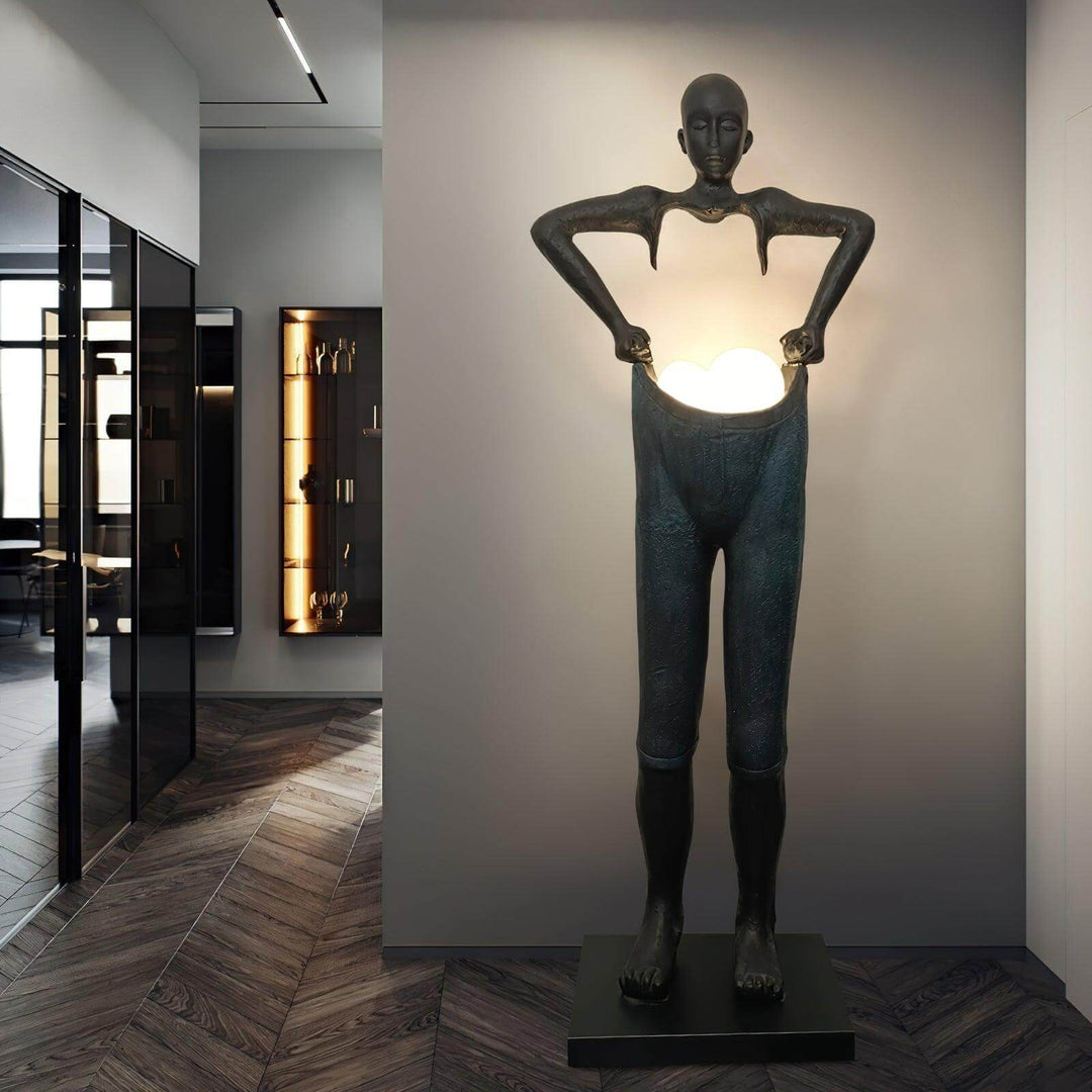 Sculptural floor lamp inspired by art deco, featuring a unique human figure design, perfect for living room lighting.